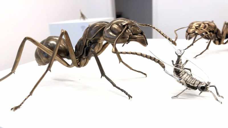 Farm To Table. bronze ant, sterling silver aphid with black glass, two-carat cubic zirconia, approximately 9 x 5 x 2.5 inches