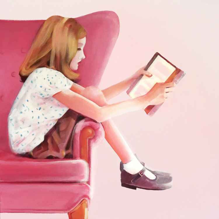Girl on a pink armchair