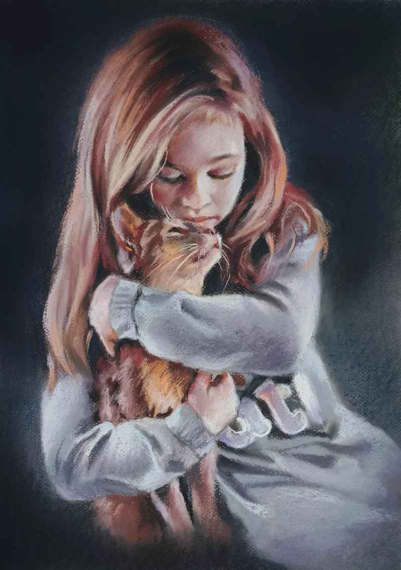 Portrait of a girl with a kitten